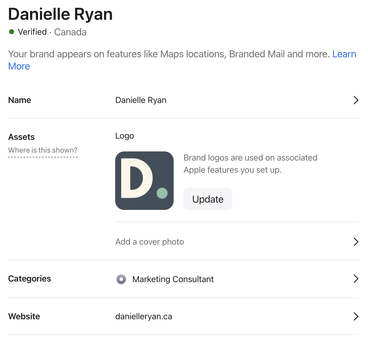 Danielle Ryan's verified Apple Business Connect profile showing name, logo, Marketing Consultant category and website